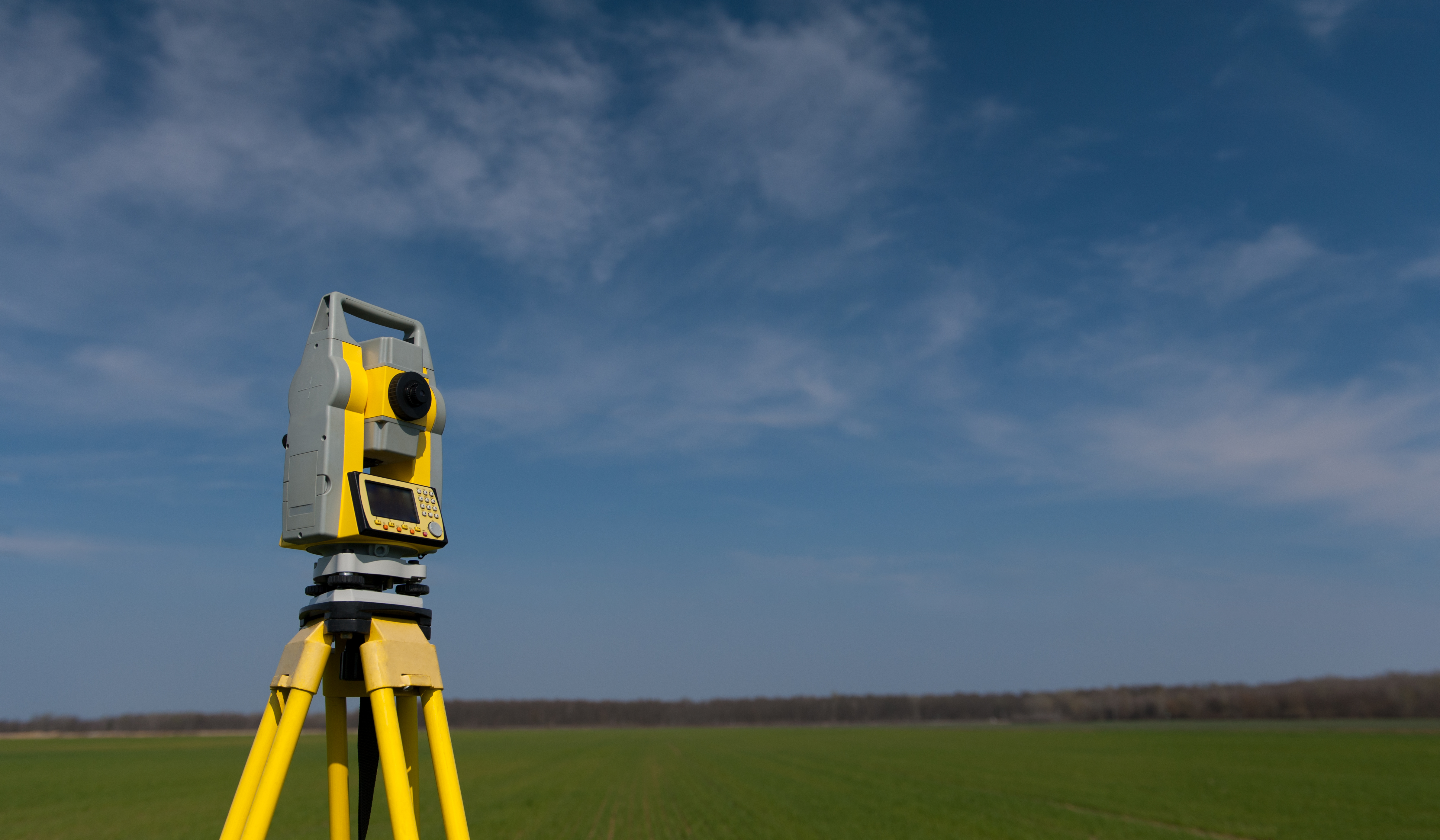 Surveyor equipment outdoors theodolite on tripod. Construction equipment and tools. Precision instrument.